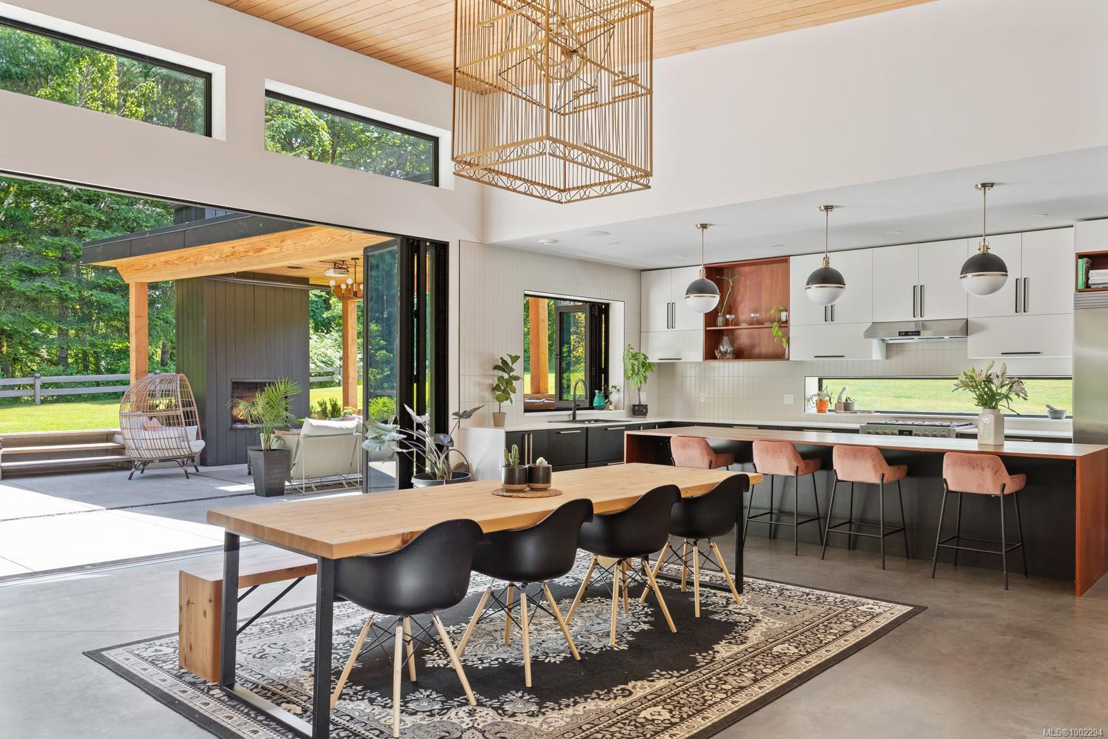 Dining open to kitchen with outdoor patio